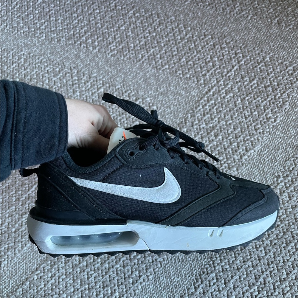 Black women’s Nike sneakers
